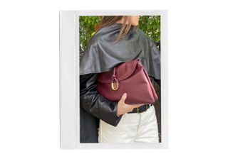 Anna LaPlaca wearing a burgundy Bottega Veneta Liberta Bag.