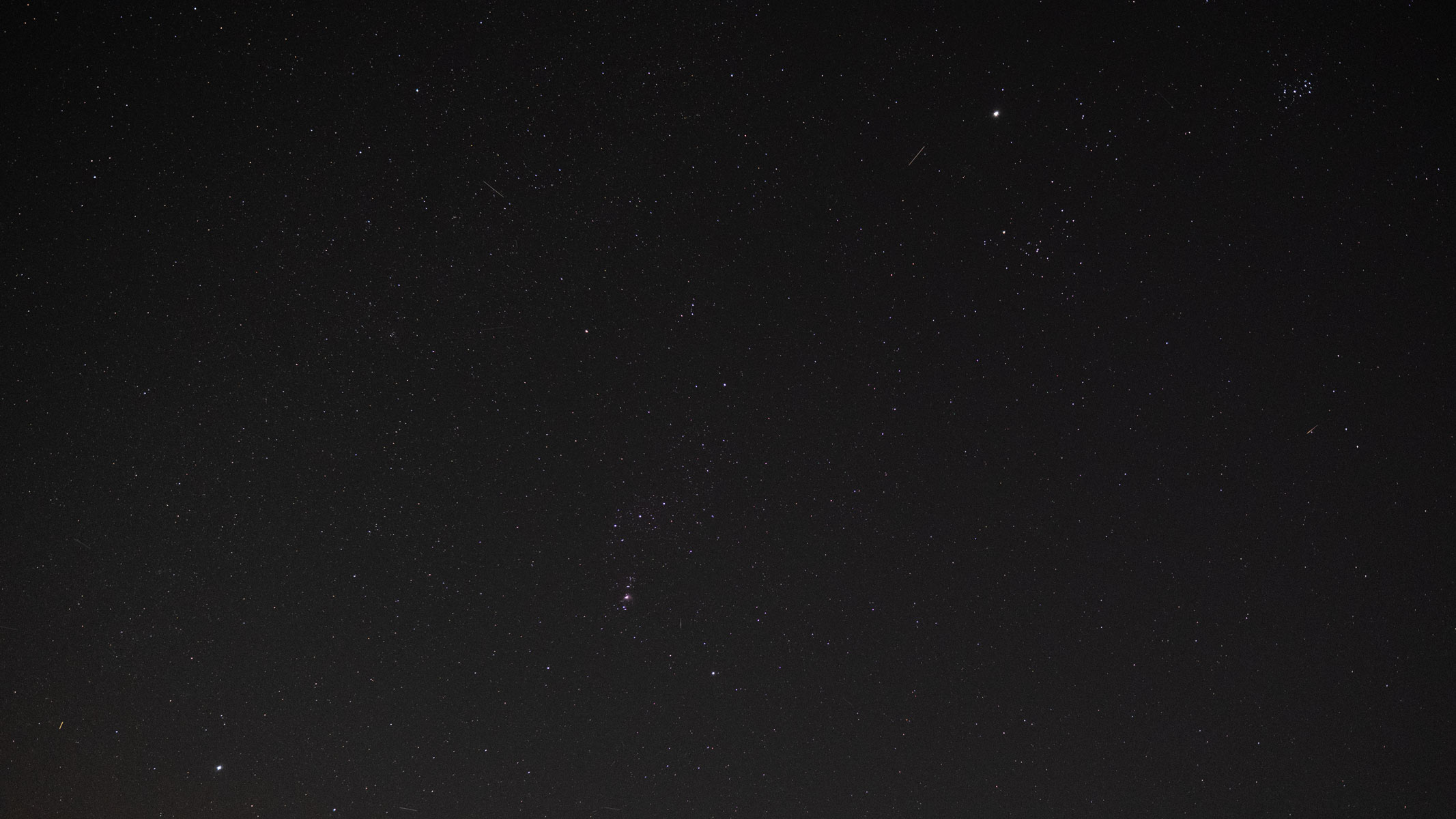 Orion constellation, Jupiter and the Pleiades in the night sky.