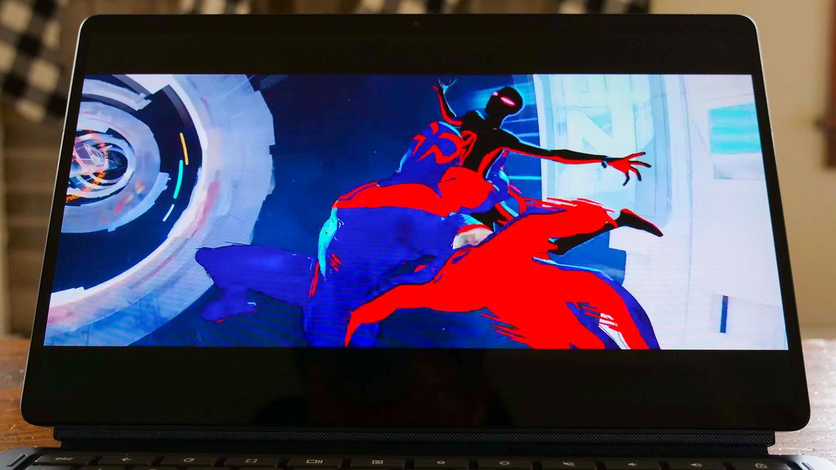 A close up of a laptop display showing a scene from the "Into the Spiderverse 2" trailer