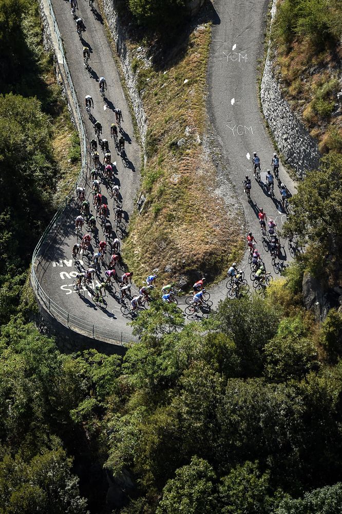 Riders round a switchback on the Col du Glandon.