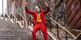 Joaquin Phoenix dancing on steps as Joker