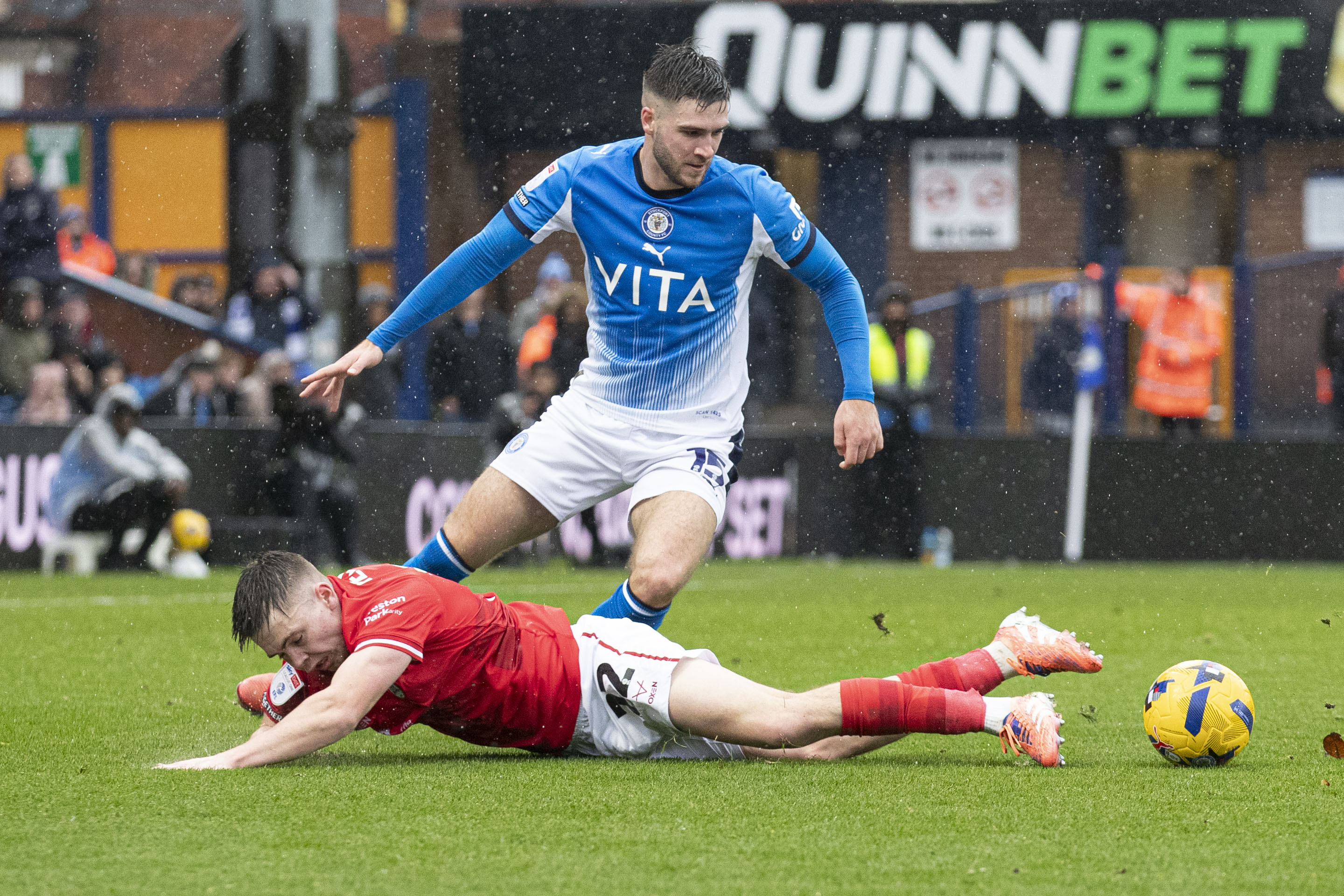 Ethan Pye #15 of Stockport County F.C. stops Patrick Kelly #22 of Barnsley F.C. in the penalty area during the Sky Bet League 1 match between Stockport County and Barnsley at the Edgeley Park Stadium in Stockport, on November 29, 2025. (Photo by Mike Morese/MI News/NurPhoto via Getty Images)