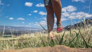 best barefoot running shoes: person running in barefoot runners