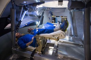 Astronauts Inside Orion Capsule Mockup