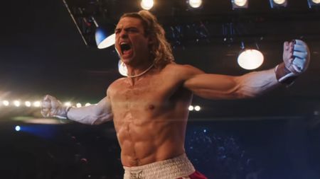 Noah Centino as Ken in Street Fighter, screaming and holding his arms out 