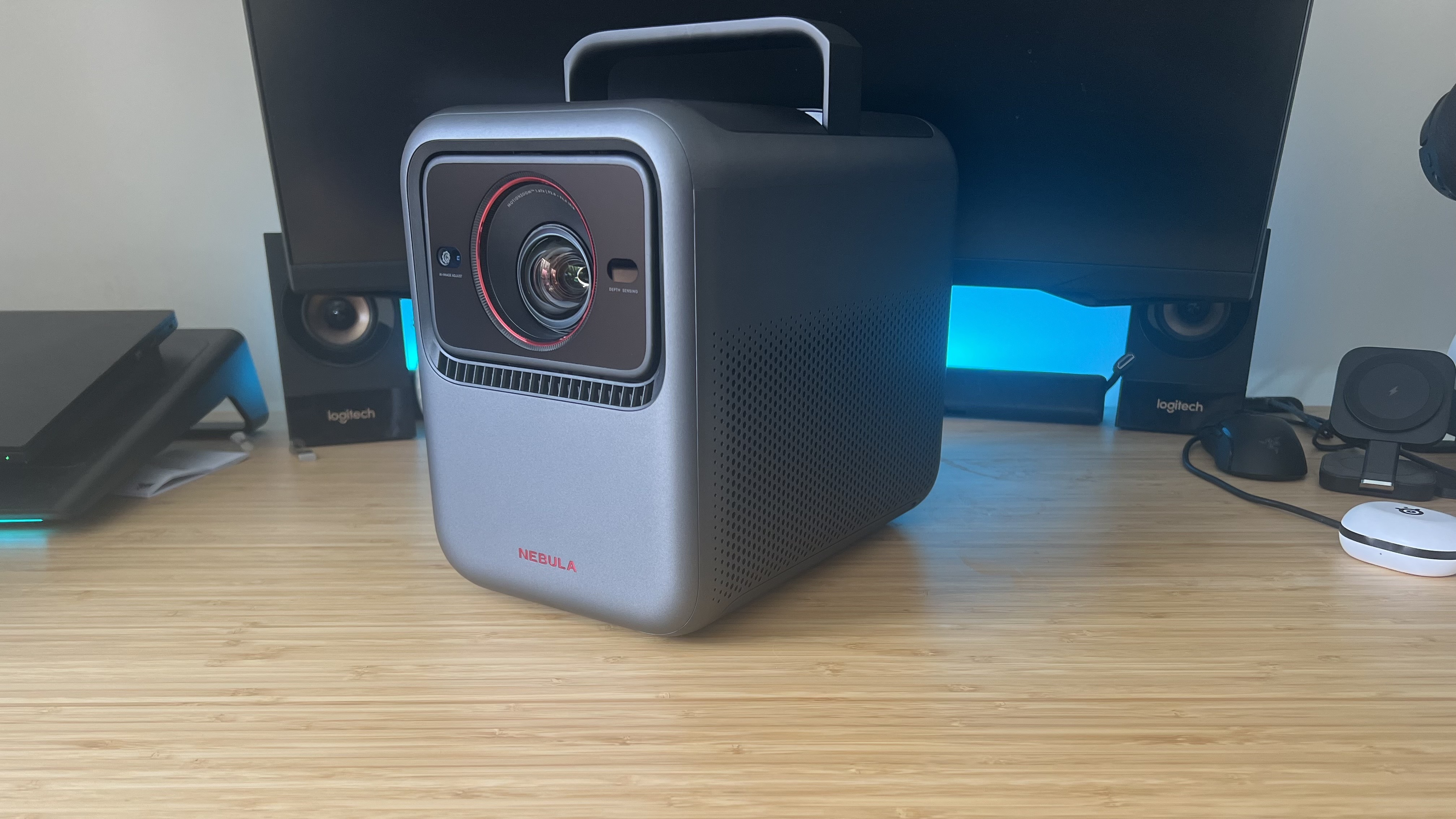 Anker Nebula X1 projector on a wooden desk