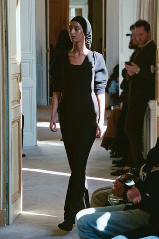 a model walks The Row winter 2025 runway during Paris Fashion Week