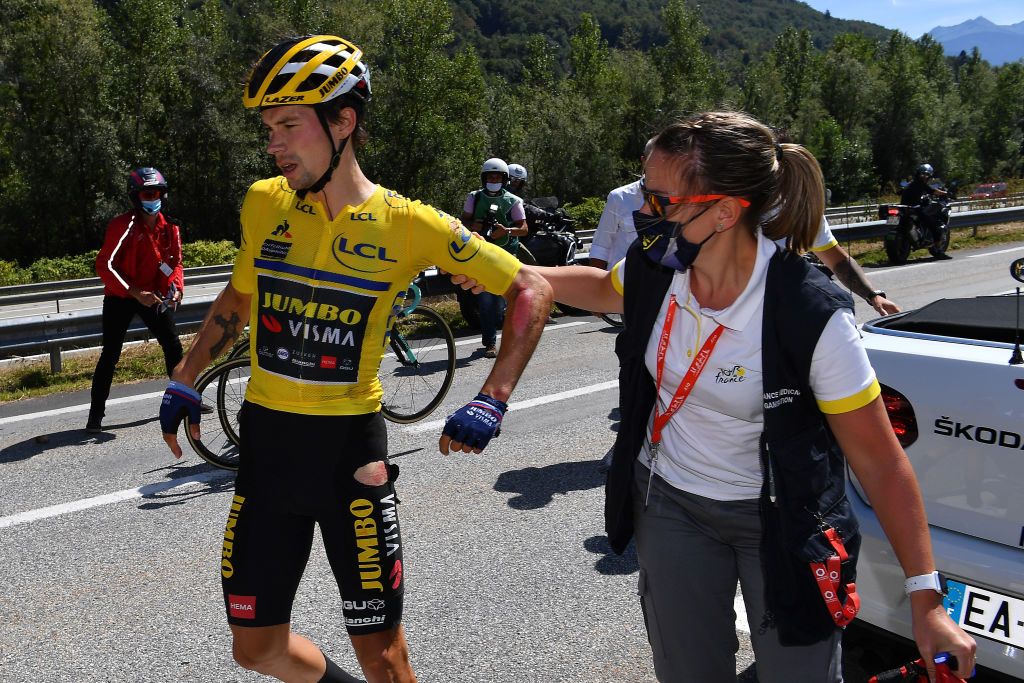 Primoz Roglic is checked by the race doctor