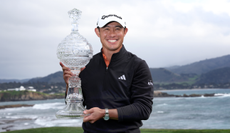 Collin Morikawa holds the AT&T Pebble Beach Pro-Am trophy
