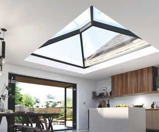 The interior of a modern kitchen with an expansive roof lantern