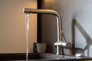 a running faucet in a kitchen