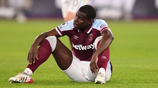 Kurt Zouma sits on the pitch during West Ham vs Watford