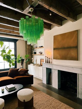 a living room with a bright green glass chandelier