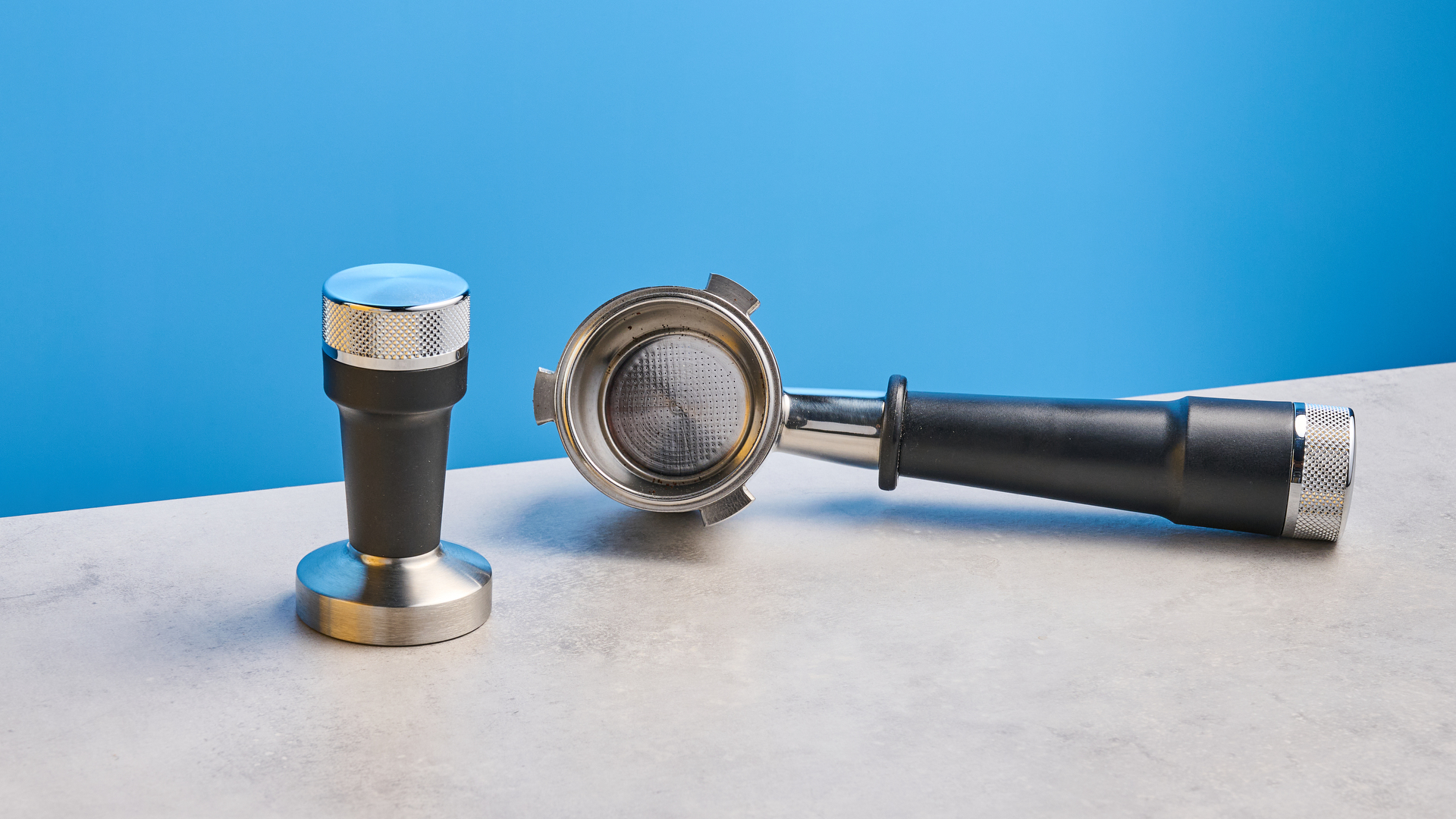 the de&#039;longhi la specialista arte evo special edition truestart edition, with yellow body, showing the espresso machine attachments like tamper, tamping collar, grinder, and control buttons