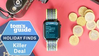 Apple Watch SE on a red table next to foreign currency