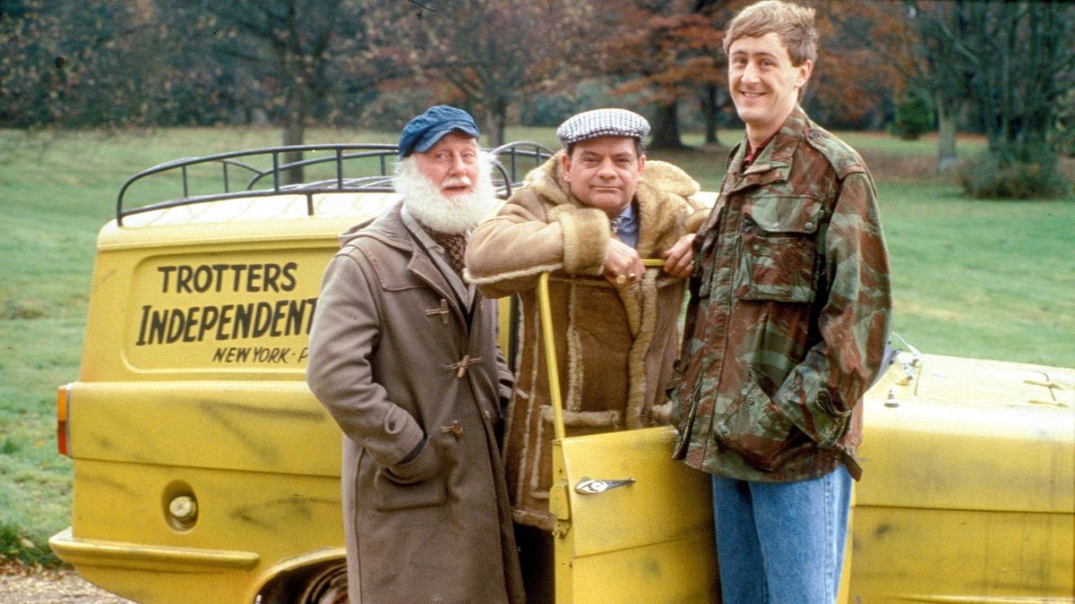 Del Boy, Grandad and Rodney stood next to the Trotters&#039; Reliant Regal in Only Fools and Horses