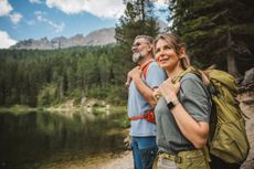 A senior couple hiking in a beautiful nature reserve.