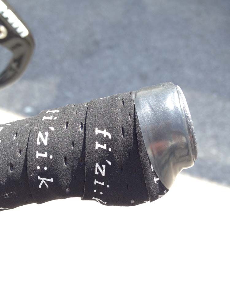 SRAM wireless now moves onto time-trial bikes, note the small one-click satellite button-style shifter hidden beneath the bar tape on these aero extensions