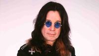 Ozzy Osbourne posing for a photograph in the early 2000s