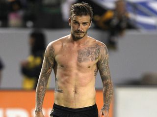 David Beckham shows off his hot body on the football pitch