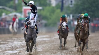 ockey Jaime Torres celebrates after riding Seize the Grey #6 to win the 149th running of the Preakness Stakes 