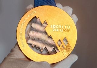 An example of the gold medal that will be awarded to athletes at the 2014 Sochi Olympic Winter Games in Russia.