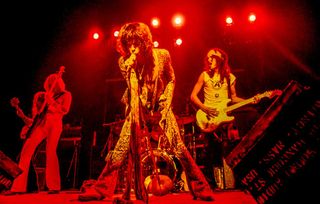 Rock group Aerosmith (L-R) Brad Whitford, Tom Hamilton, Steven Tyler, Joey Kramer (hidden) and Joe Perry perform at The Orpheum Theater, Boston, MA October 27, 1973