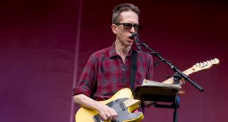 Glenn Mercer of the Feelies plays a T-style electric guitar as he performs at the 2017 Pitchfork Festival.