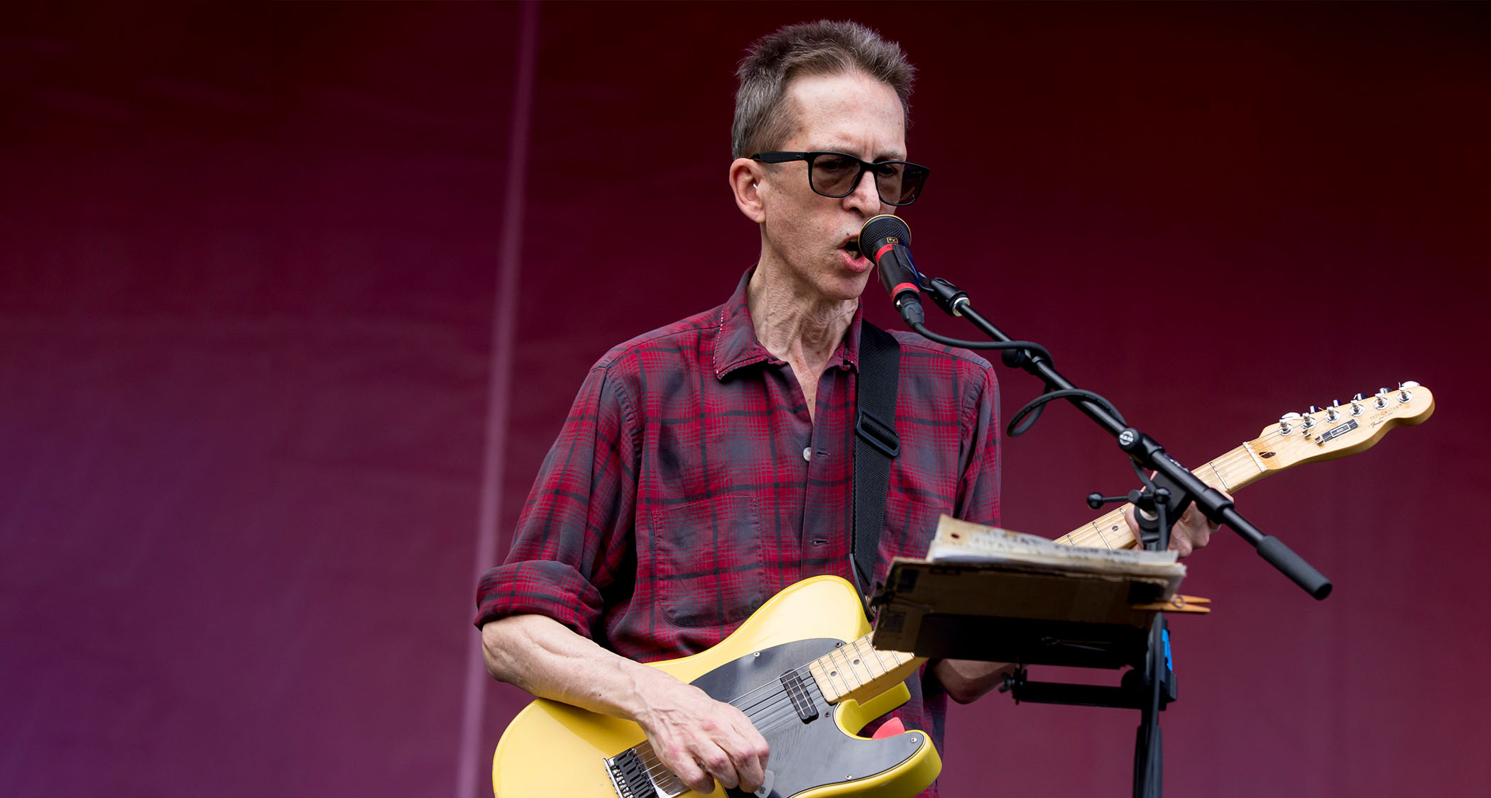 Glenn Mercer of the Feelies plays a T-style electric guitar as he performs at the 2017 Pitchfork Festival.