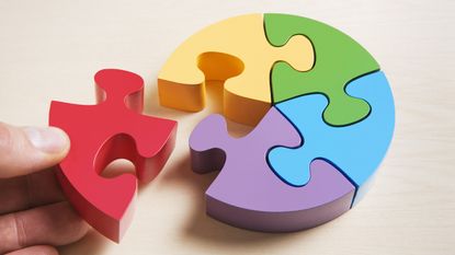A round puzzle with six pieces in different colors.