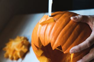 Carving a pumpkin design