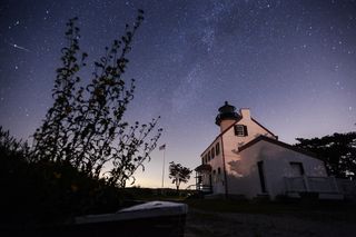 Astrophotographer Jeff Berkes captured this view of the 2019 Perseid meteor shower from the East Point Lighthouse in Heislerville, New Jersey.