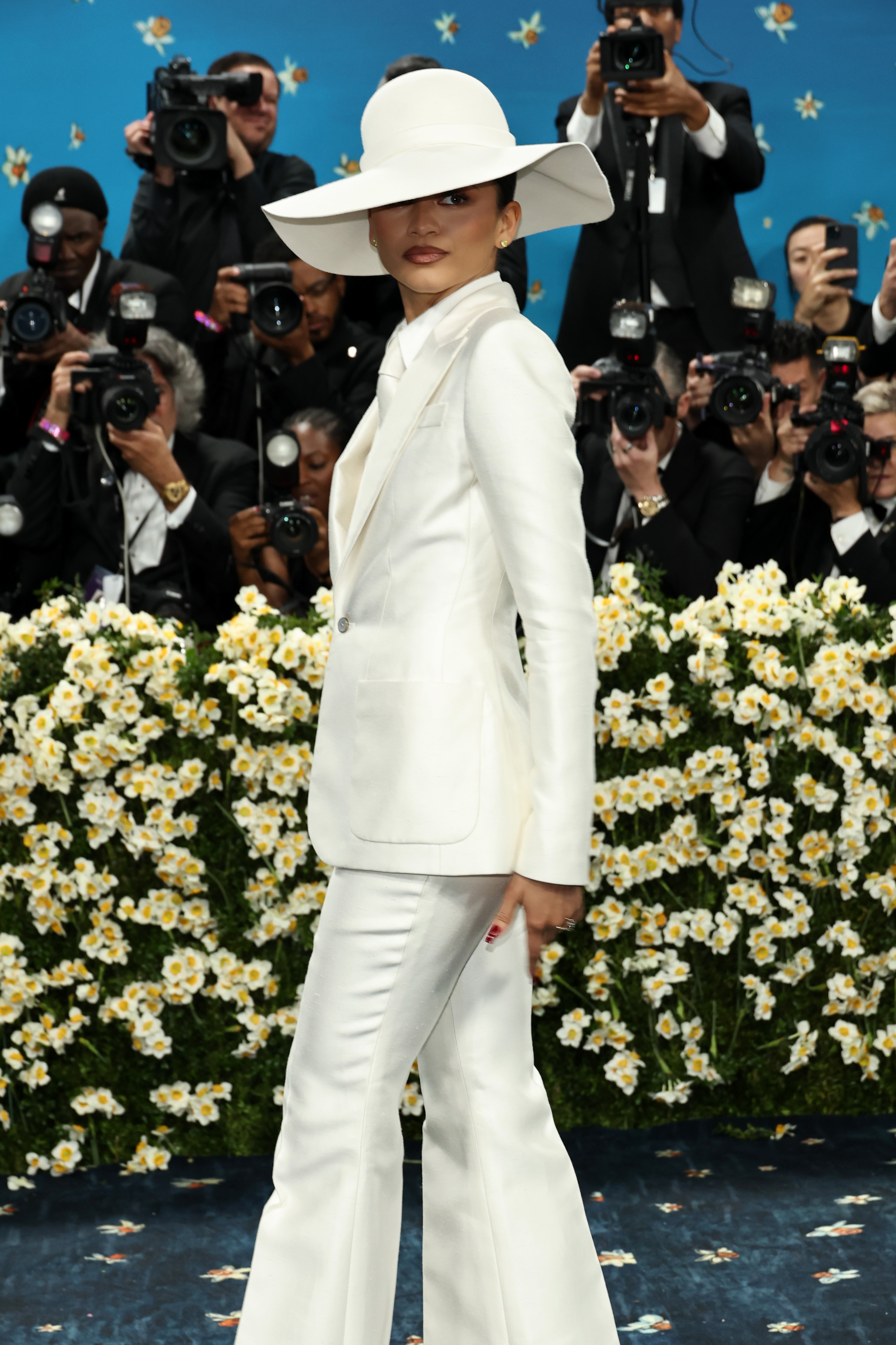 Zendaya at the 2025 met gala in a white suit