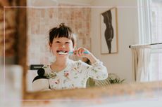 Little girl brushing her teeth