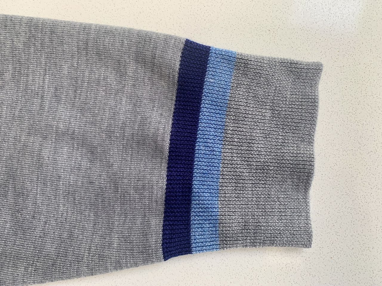 G/FORE Quarter Zip V Neck Sweater sleeve detail
