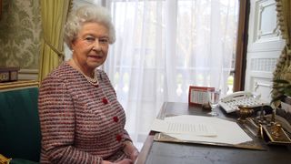 Queen Elizabeth II records the Commonwealth Day Message in the Regency Room at Buckingham Palace