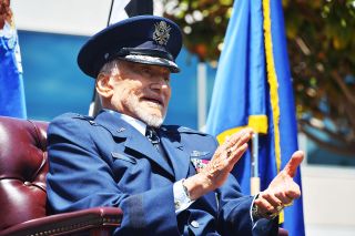 Retired Brig. Gen Buzz Aldrin sits on stage during his honorary promotion ceremony at Space Systems Command at Los Angeles Air Force Base in California on May 5, 2023.