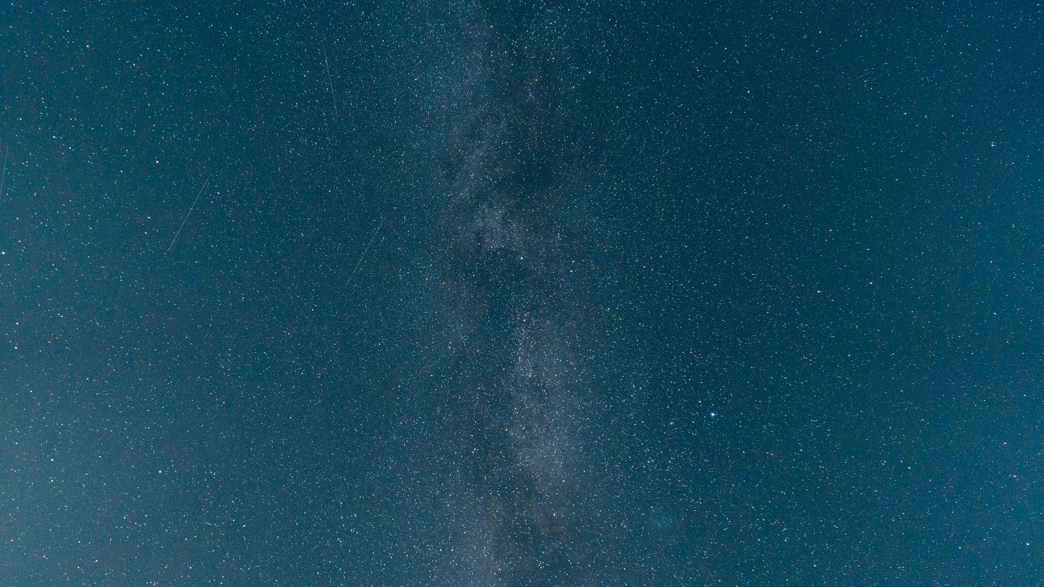 The galactic core of the Milky Way cutting down the middle of the sky.
