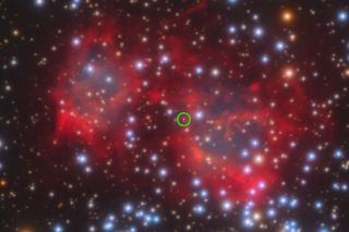The pinkish-red haze from the header image is zoomed-in. A green circle is drawn to denote the center with the planetary nebula and dead star.
