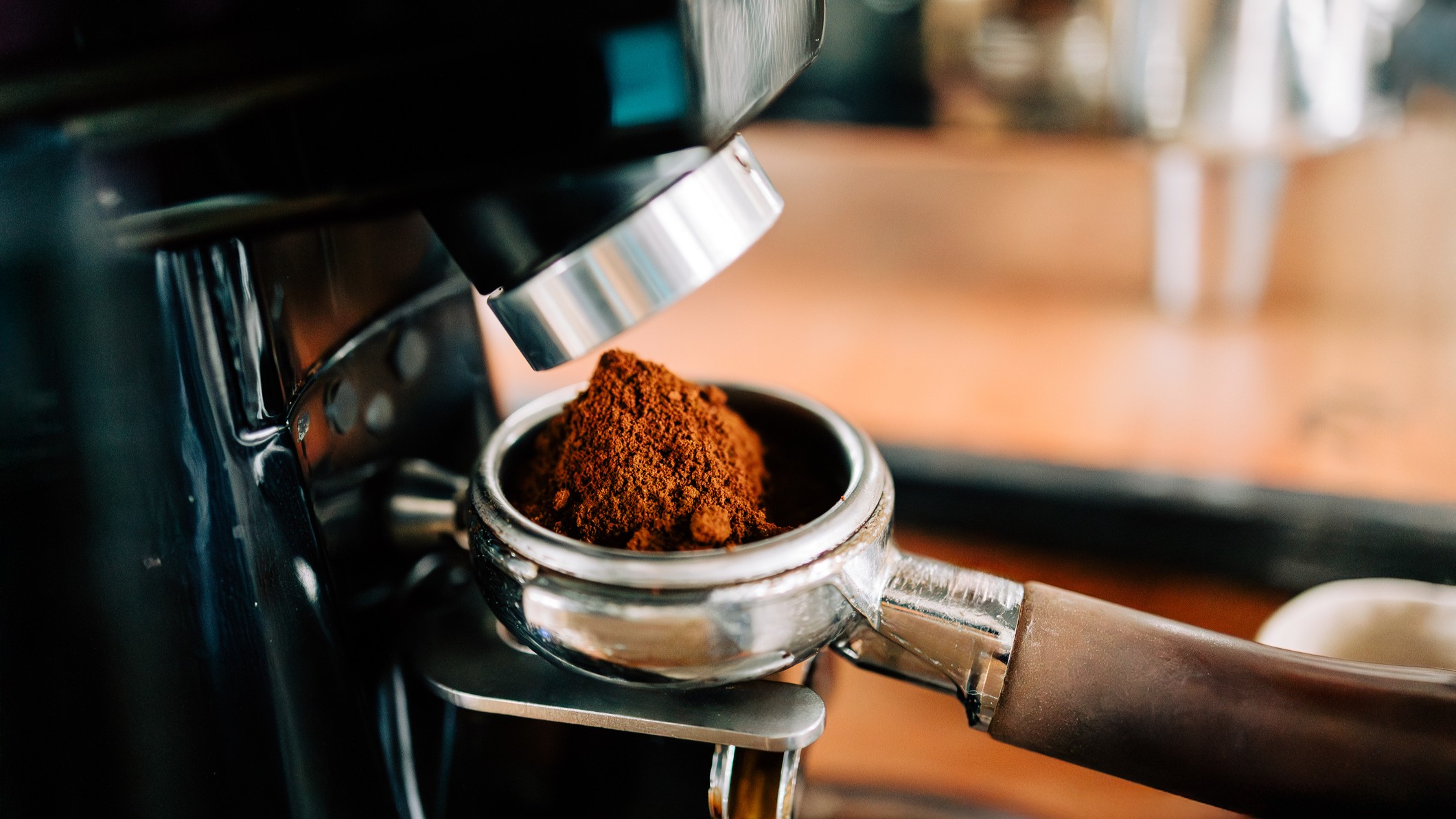 Coffee being ground into filter basket