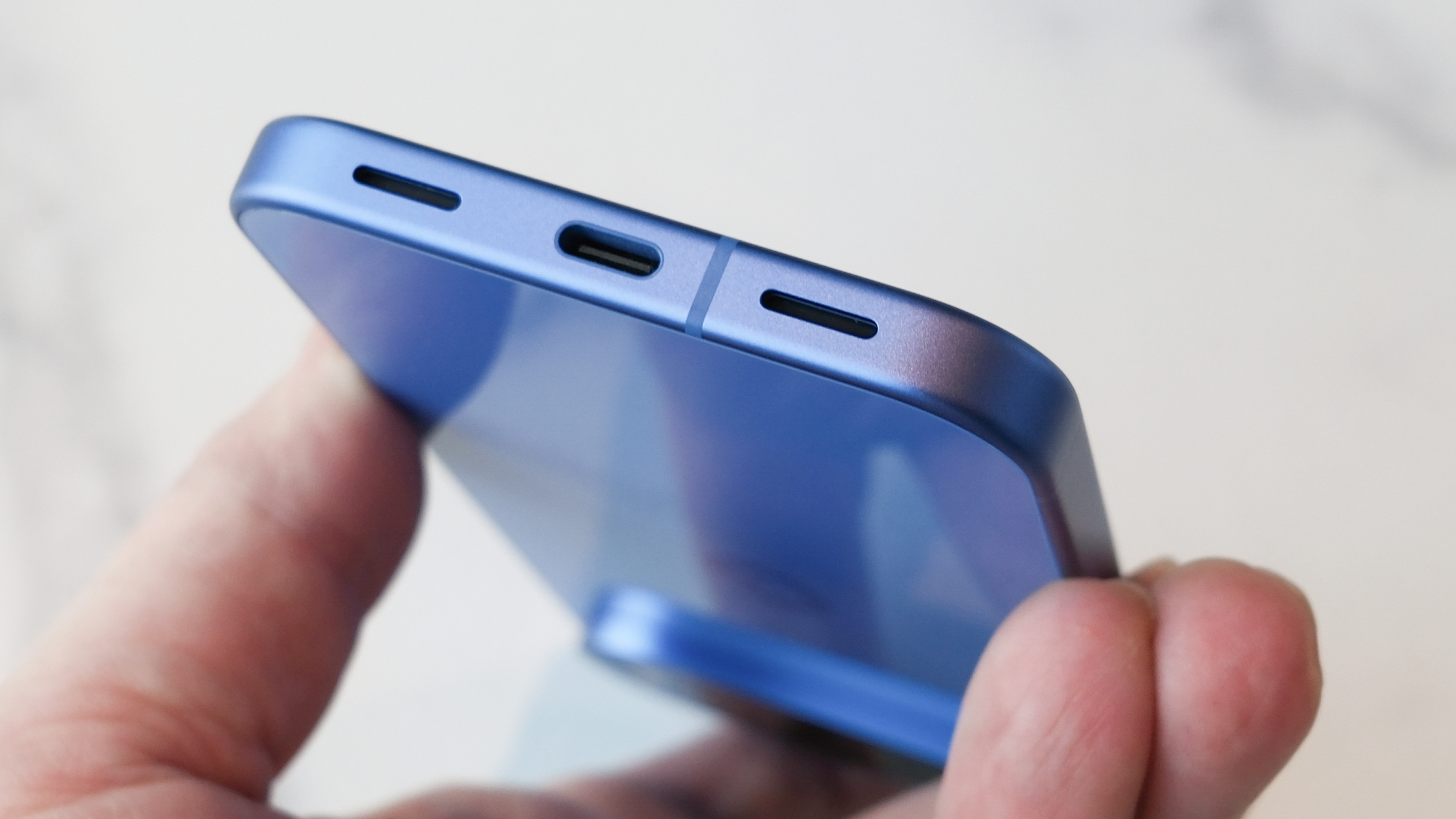Google Pixel 10 in blue showing USB-C port