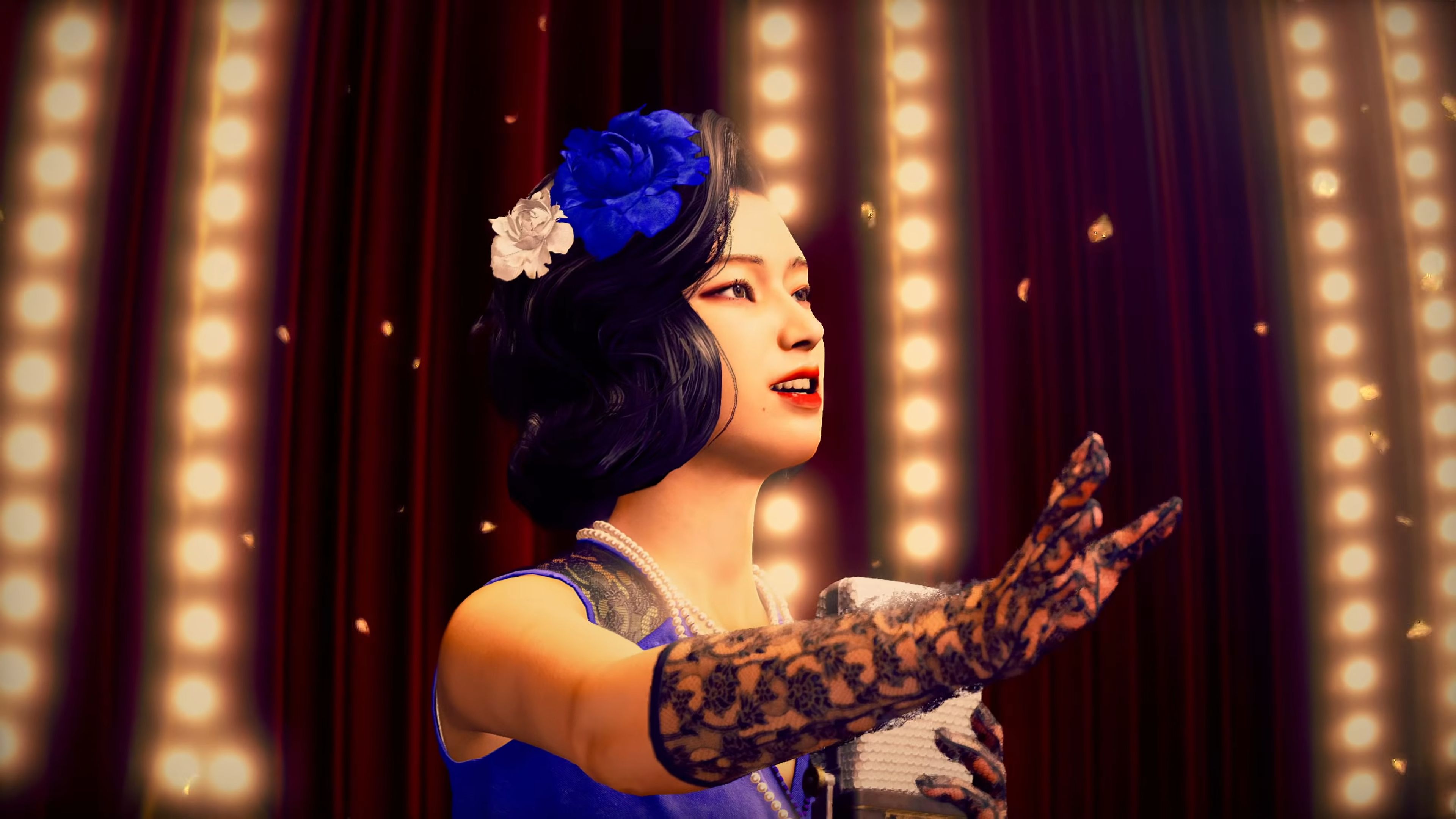 Stranger Than Heaven - A female singer in a blue dress and black gloves performs on a theater stage with a microphone