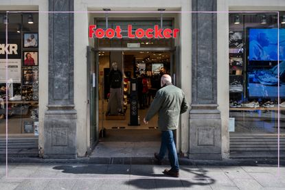 The front of a Foot Locker store with a man walking in