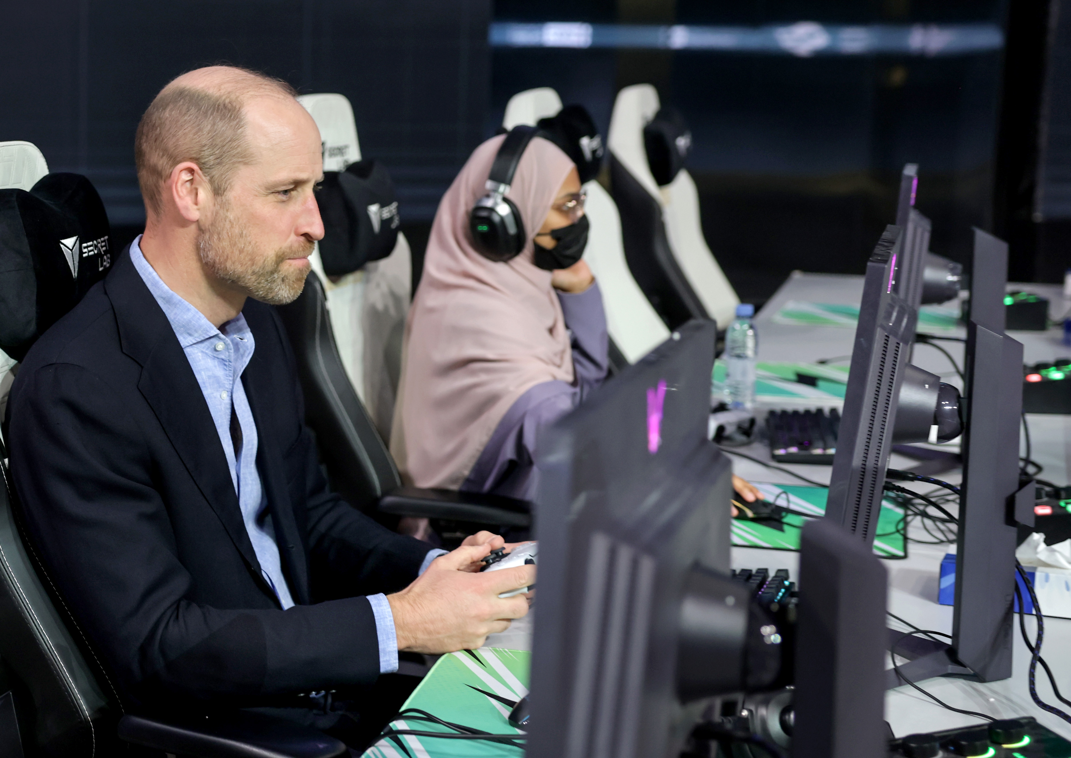 Prince William playing e-sports at a table