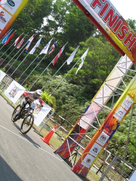 Risa Suseanty (Indonesia) crosses the finish line in the elite women's downhill.