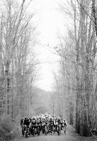 The peloton negotiates a dirt road section during the Tour of the Battenkill.
