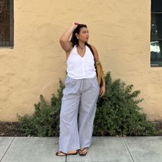 Influencer wears square-toe flip flops.