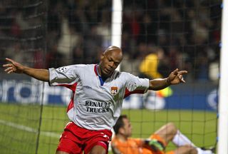 Sylvain Wiltord celebrates after scoring for Lyon against Werder Bremen in the Champions League in March 2005.