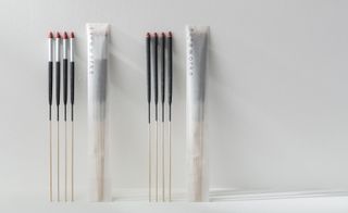 View of two sets of the Method Inc and Yamagata Co Ltd fireworks in and out of their packaging pictured side-by-side against a light coloured background