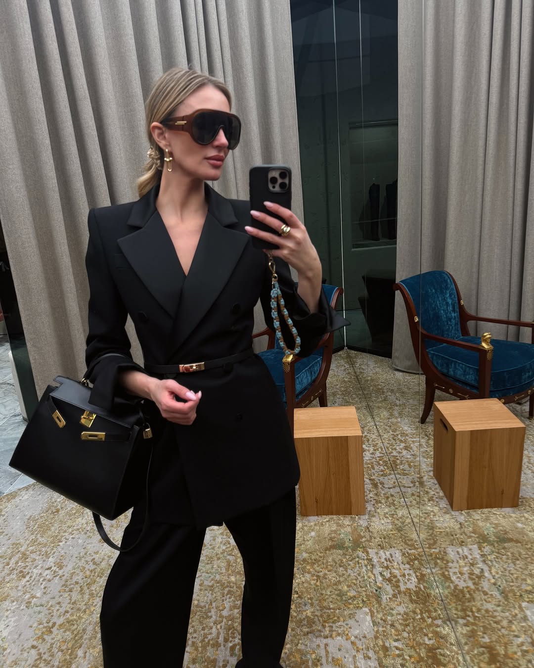 woman wearing oversize sunglasses outfit 2026